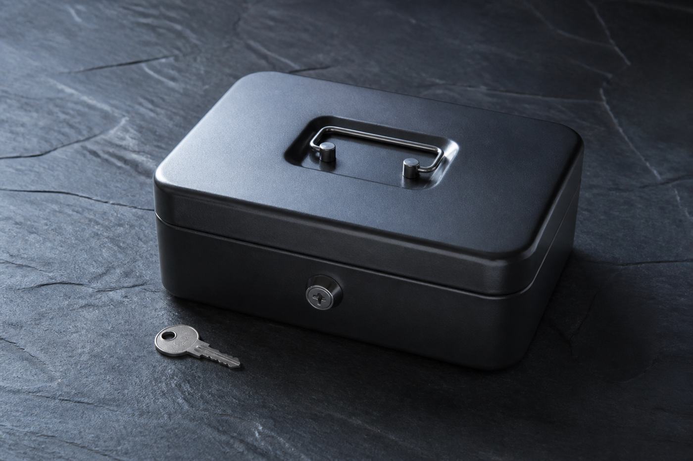 Metal lockbox and key on slate, N1Bet privacy banner